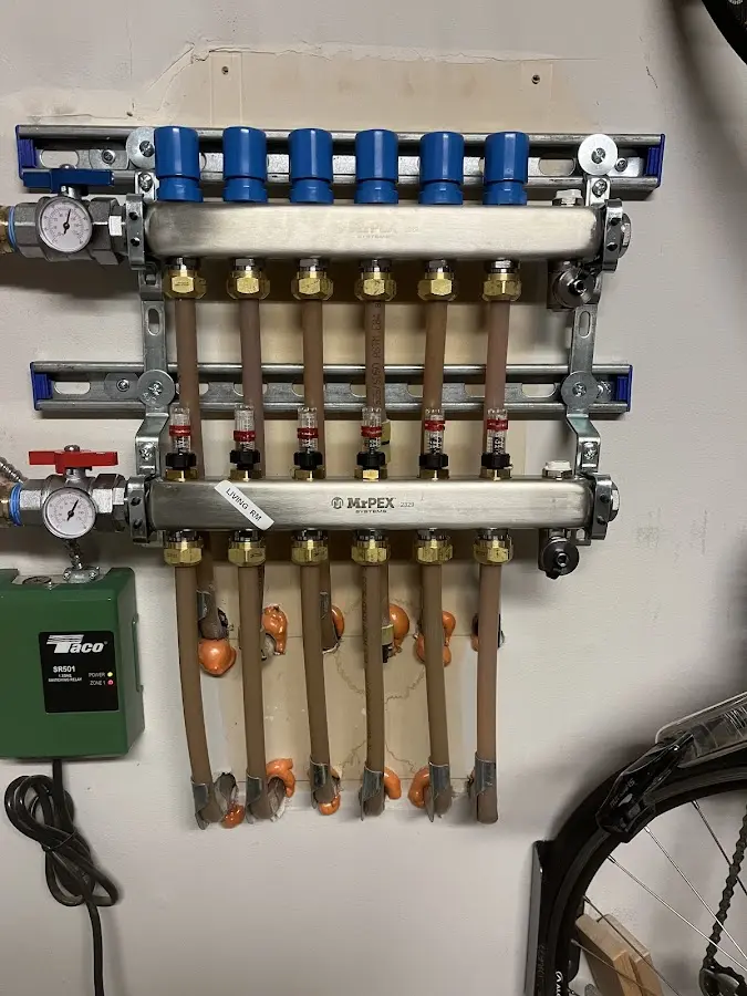 Plumber performing Water Heater Repair at a residential property in Warrior